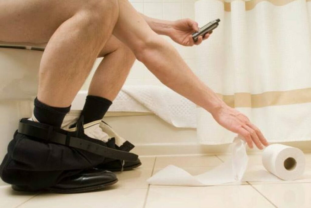 a man's legs fall asleep on the toilet