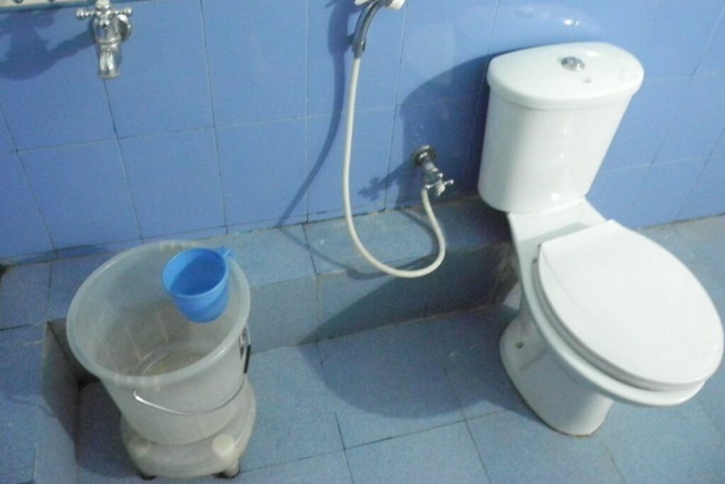 bucket of water in a bathroom