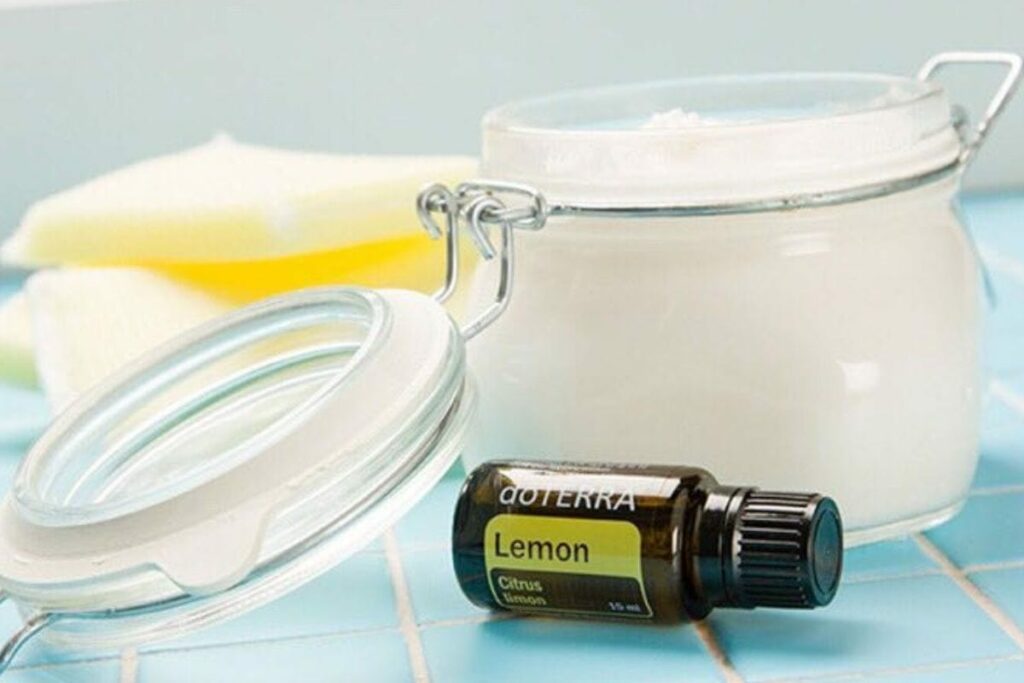 scrubbing paste in a jar and lemon essential oil