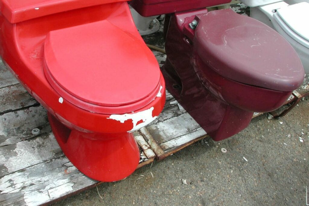 a red and maroon toilet