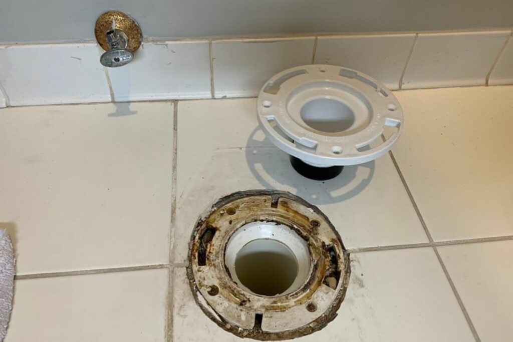 an existing toilet flange with extender