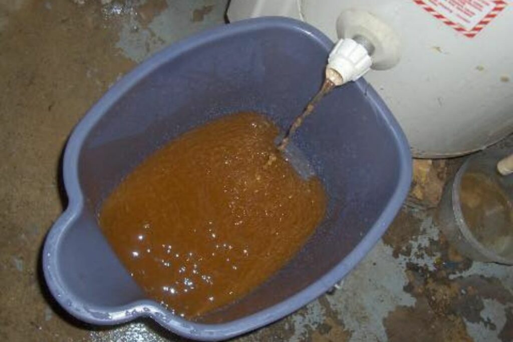 hard water deposits or sediments coming out of a hot water tank