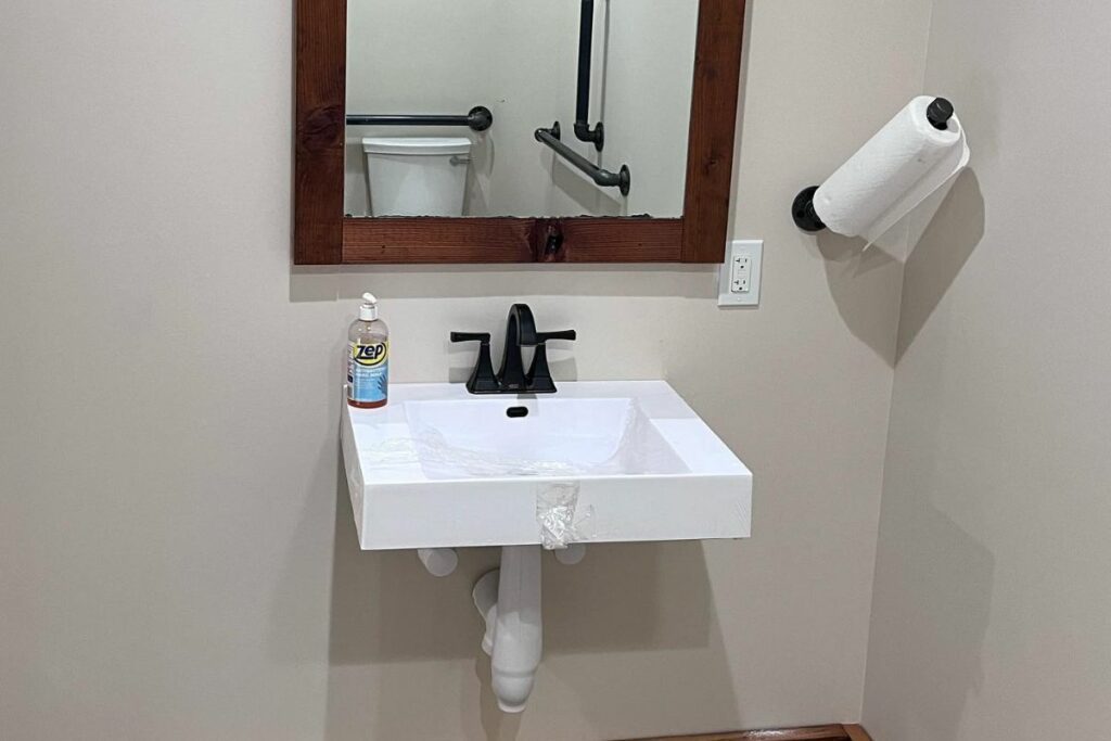 accessible mirror and sink in ADA-compliant toilet