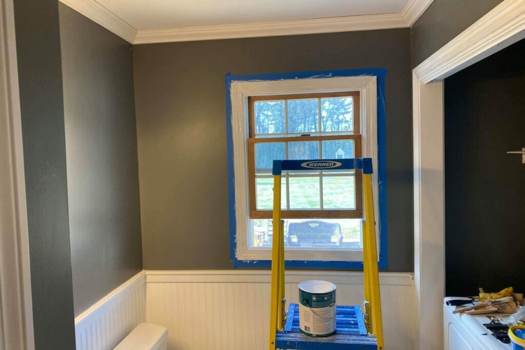 painting a bathroom with window open