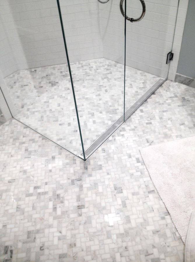 a Curbless shower with linear drain