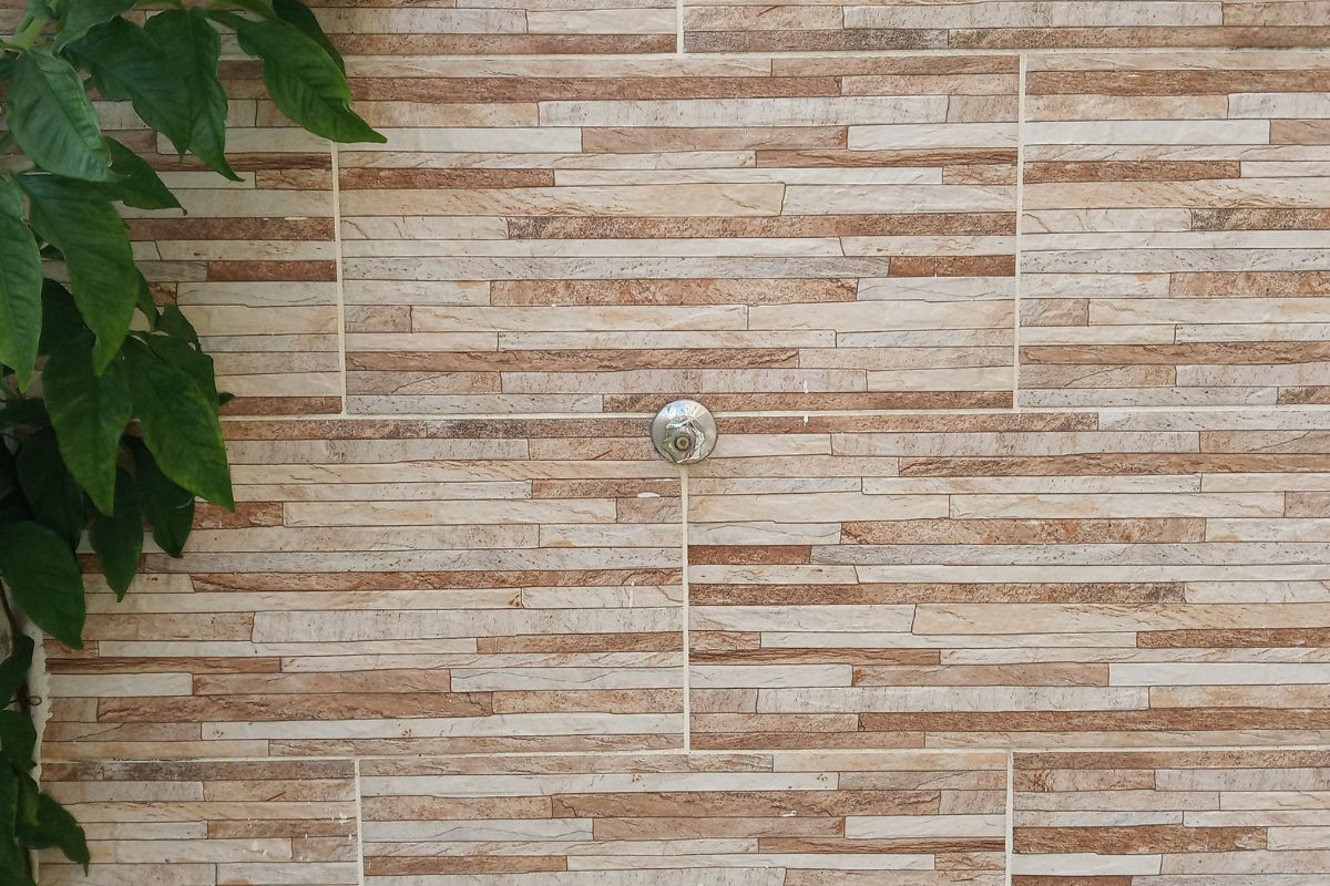 brown marble tiles on shower wall