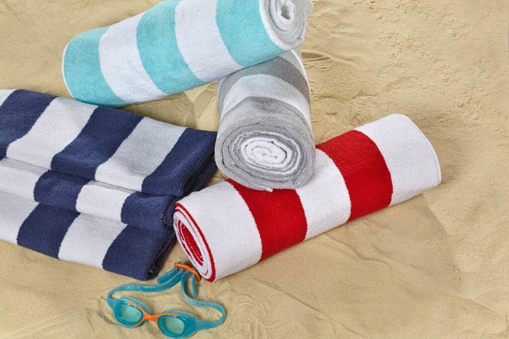 four beach towels on the beach