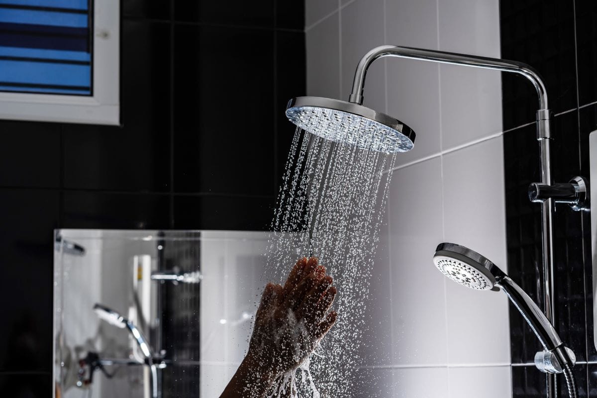 use hand to test the shower water temperature
