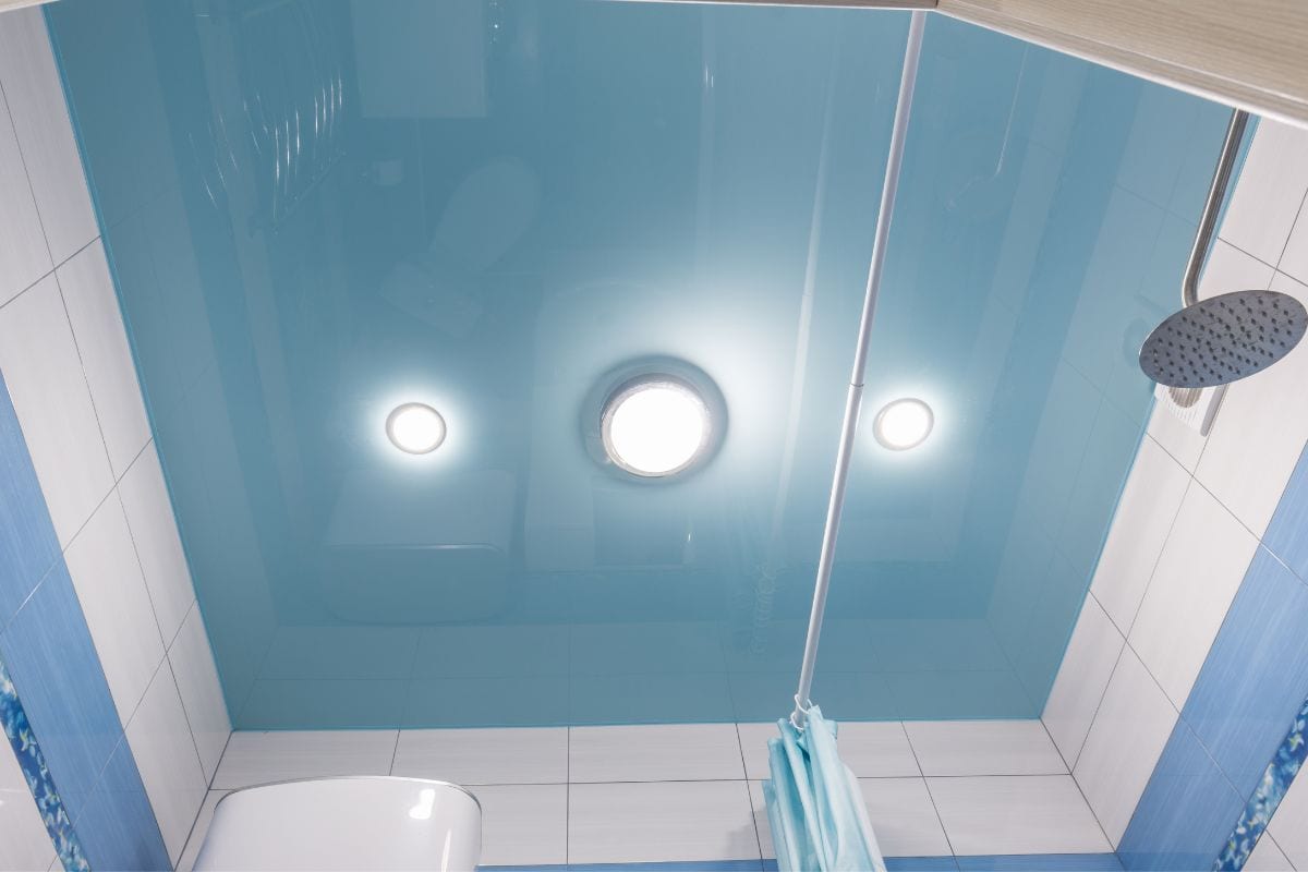 Close up view of bathroom ceiling with modern shower
