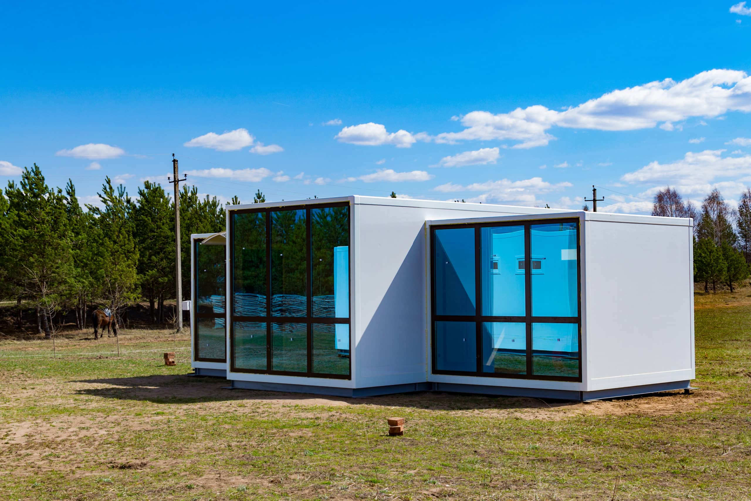 One-storey modular houses with large panoramic Windows. House of sandwich panels